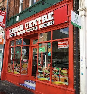 Kebab Centre at night — glowing neon shopfront