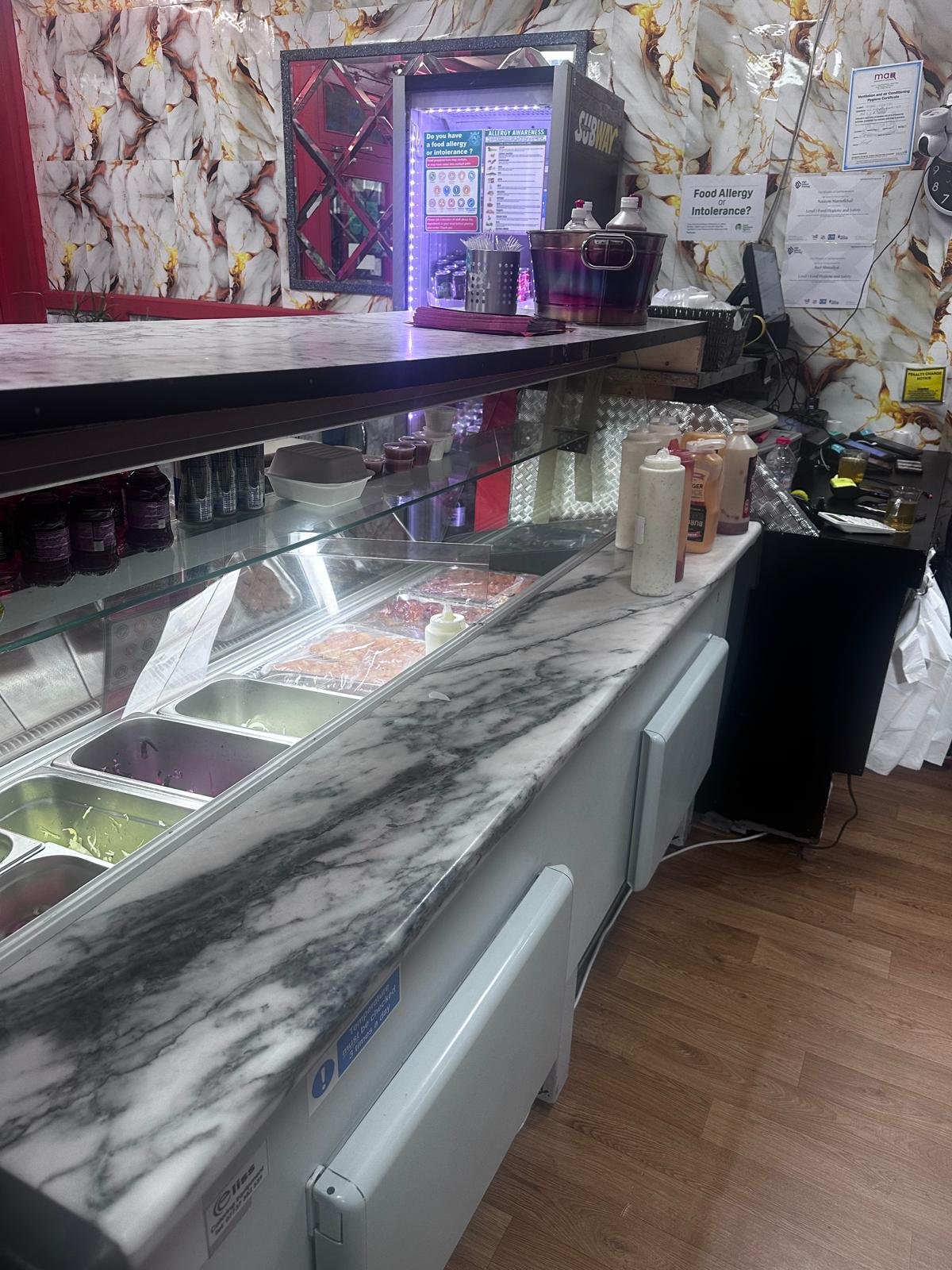 Service counter with an array of fresh toppings